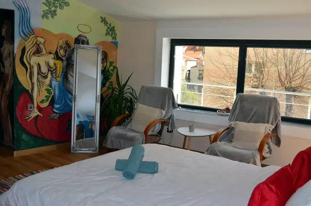 Double bed and armchairs by the window, Artistic Loft