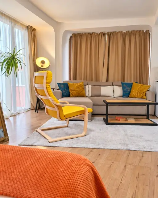 Seating area with armchair and sofa, French Windows Studio