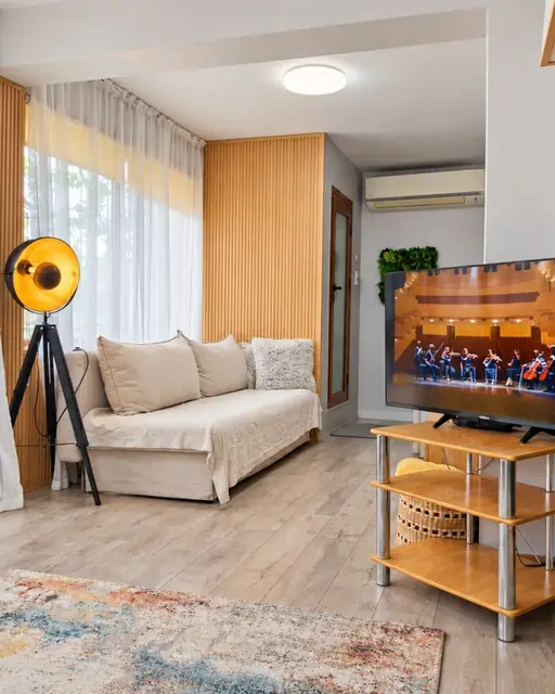Living room with sofa and TV, Green Terrace