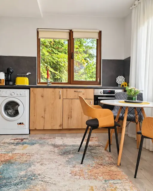 Kitchenette with washing machine and table, Green Terrace