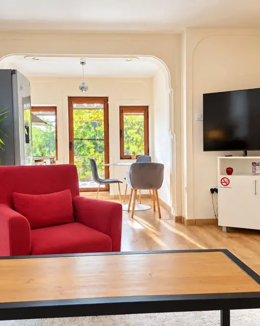 Living room with TV and armchair, Sunny Balcony