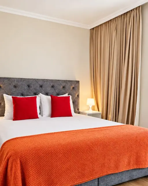 Bedroom with double bed and curtains to the balcony, Sunny Balcony